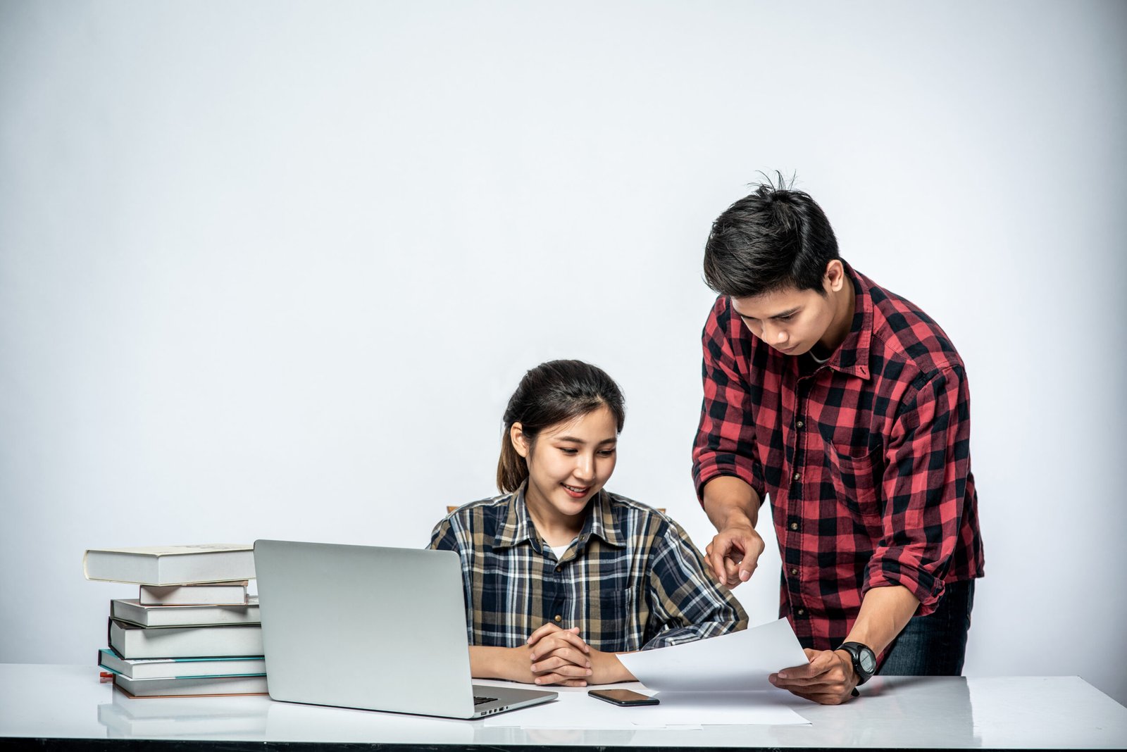 Tutor helping a student with an assignment